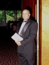 Wedding Coordinator Assistant - Mr. Robert Bailey - stands at the door to the Garden Room greeting guests as they enter the Ceremony.